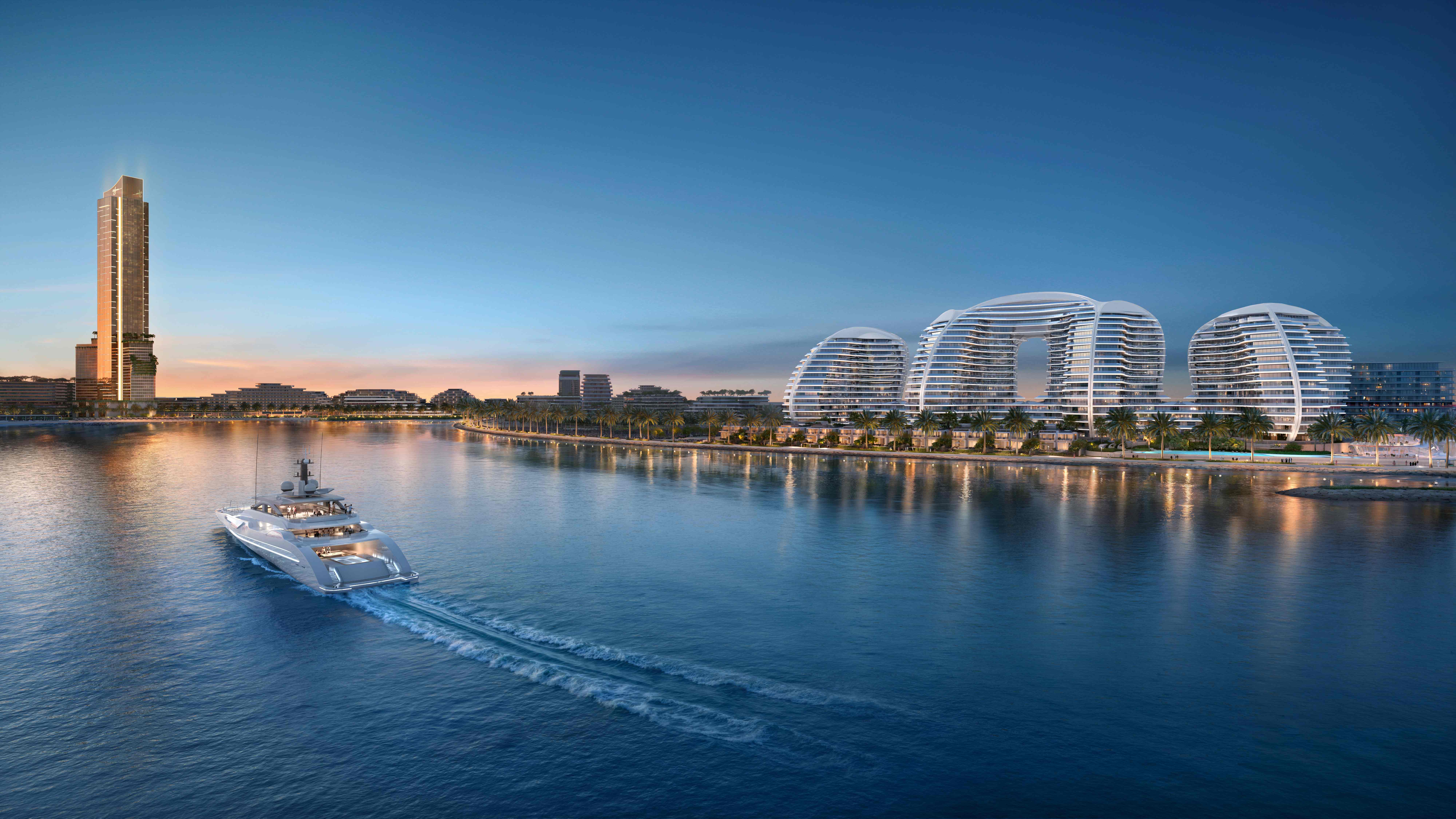 Wynn Resort Al Marjan Island - Evening Luxury Wynn Al Marjan Island resort at golden hour sunset with luxury superyacht, illuminated promenade, and iconic tower reflecting in Arabian Gulf waters